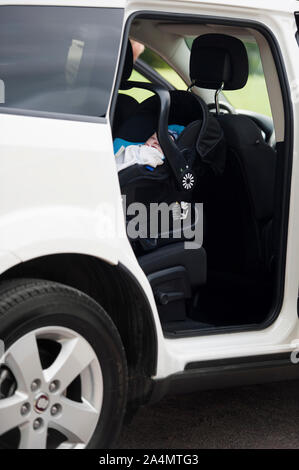 Baby sleeping in car Stock Photo