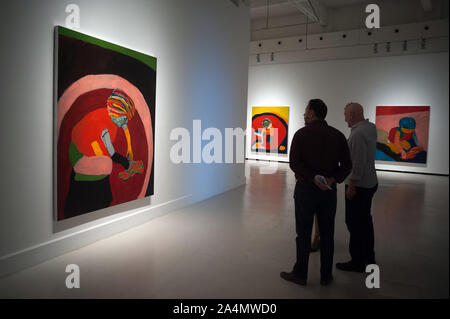 Malaga, Spain. 15th Oct, 2019. Visitors looking at a painting during the exhibition.'Eleuthera' is an exhibition at Contemporary Art Center with more than 40 works from Sean Scully as paintings, photographs and large format drawings. The artist uses colorful shapes and geometrical whose concepts are imaginational, abstract and fatherhood. The exhibit will run from 15 October until 19 January 2020. Credit: SOPA Images Limited/Alamy Live News Stock Photo