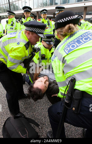 Police made mass arrests as Extinction Rebellion activists defied a London-wide ban on public protests this morning to close off Millbank outside the offices of MI5. Protesting about the lack of food security possible if climate change isn't averted, they parked a caravan in the road and staged a sit in with singing and picnics.