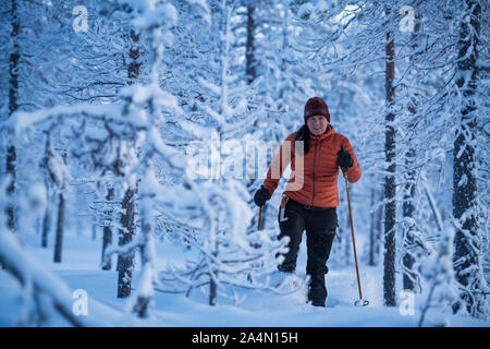 Woman cross-country skiing Stock Photo