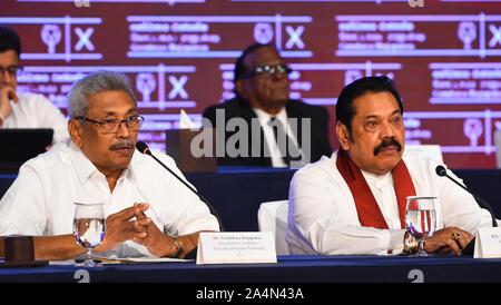 Colombo, Sri Lanka. 15th Oct, 2019. Gotabaya Rajapaksa (L), Sri Lanka's presidential candidate of the main opposition Sri Lanka Podujana Peramuna (SLPP), speaks to the press in Colombo, Sri Lanka, Oct. 15, 2019. Gotabaya Rajapaksa vowed on Tuesday to maintain a neutral foreign policy and friendly ties with all nations, if he wins the presidential election on Nov. 16. Credit: A.Hapuarchchi/Xinhua/Alamy Live News