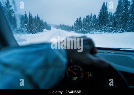 Winter road seen through windshield Stock Photo