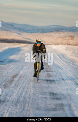 Man cycling at winter Stock Photo