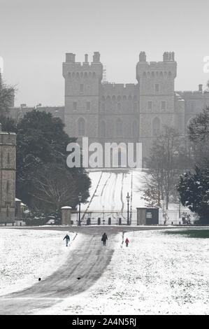 Windsor Castle covered in winter snow as seen from the Long Walk, Windsor Berkshire England UK Stock Photo