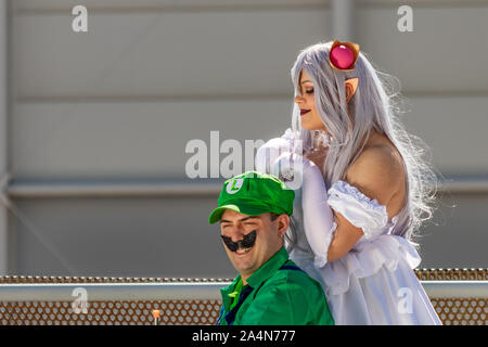 Rome, Italy, 5 April 2019, Comic and Cosplayer event called 'Romix'. Close ups and medium shots of 'Luigi and Princess' in daylight. Famous videogame Stock Photo
