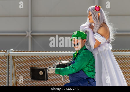 Rome, Italy, 5 April 2019, Comic and Cosplayer event called 'Romix'. Close ups and medium shots of 'Luigi and Princess' in daylight. Famous videogame Stock Photo