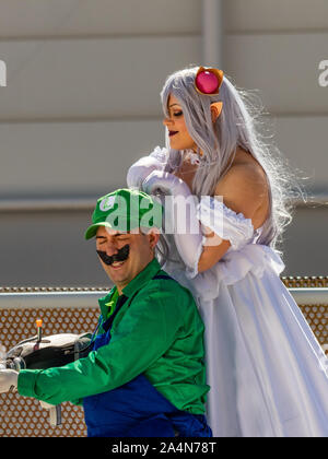 Rome, Italy, 5 April 2019, Comic and Cosplayer event called 'Romix'. Close ups and medium shots of 'Luigi and Princess' in daylight. Famous videogame Stock Photo