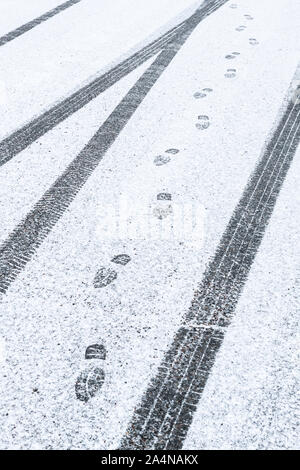 Tire tracks in snow Stock Photo