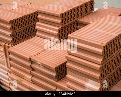 Stack of bricks on wooden pallet Stock Photo