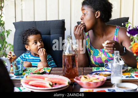 Mother and son having meal together Stock Photo