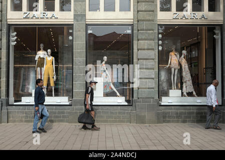 Mannequins watch passersby from the shopfront windows at Zara store near Flora fountain in Mumbai, India. Stock Photo