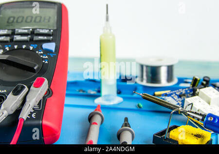 The electrician's workplace. Electronics. Schemes soldering iron. multimeter Stock Photo