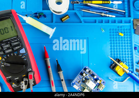 The electrician's workplace. Electronics. Schemes soldering iron. multimeter Stock Photo