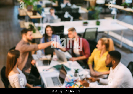 Creative colleagues working at desk in office Stock Photo