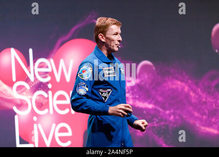 Astronaut, Tim Peake giving a talk 'Return to the Moon', describing the motivation and challenges of visiting our neighbour in space, on the main stage at New Scientist Live 2019 Stock Photo