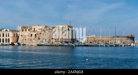 Panoramic view across harbour to Angevine-Aragonese Castle in Gallipoli old town, Apulia (Puglia) in Southern Italy Stock Photo