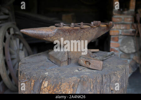 old anvil hammer, nails and horseshoes Stock Photo