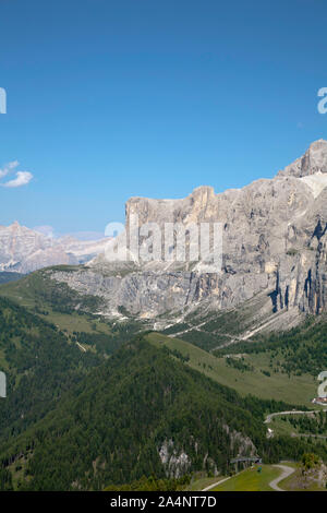 The Passo Gardena Grodner Joch  passing  between the Sella Gruppe  and Grand Cir   the Fanes Massif  in distance Selva Val Gardena Dolomites  Italy Stock Photo