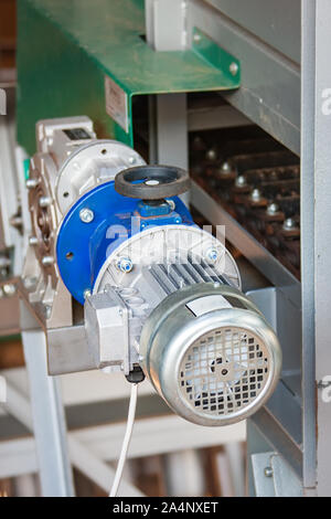 Electric motors used in agriculture on various machinery in a warehouse Stock Photo