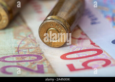 Dirty African money together with bullets criminal activities, pula, rand Stock Photo