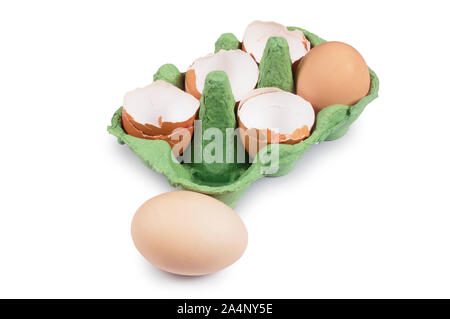 Studio shot of cracked egg shells in an egg box isolated on white - John Gollop Stock Photo