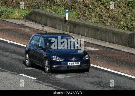 A VW Volkswagen Golf heading southbound on the M6 motorway near Preston in Lancashire, UK Stock Photo