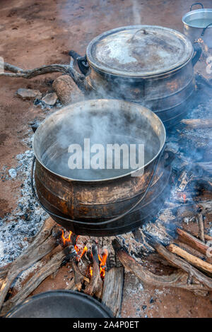 Cooking in a large pot, outside Stock Photo - Alamy