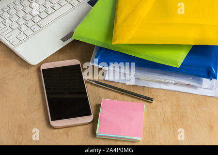 Different office accessories on the wooden table. Modern office workplace. Copy space Stock Photo
