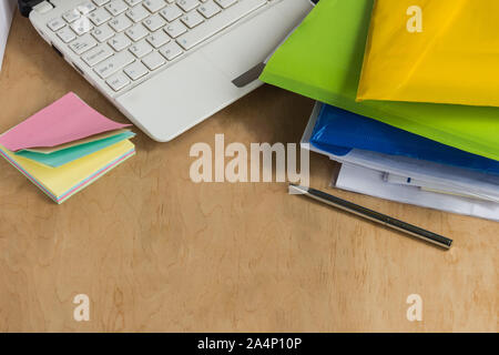 Different office accessories on the wooden table. Modern office workplace. Copy space. Stock Photo