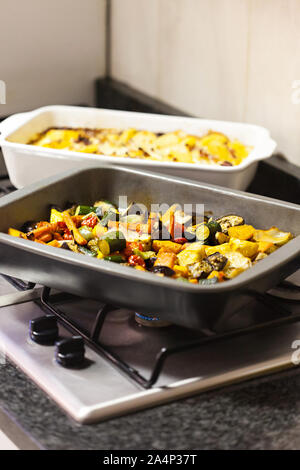 warming baked home cooked vegetables on the gas stove Stock Photo