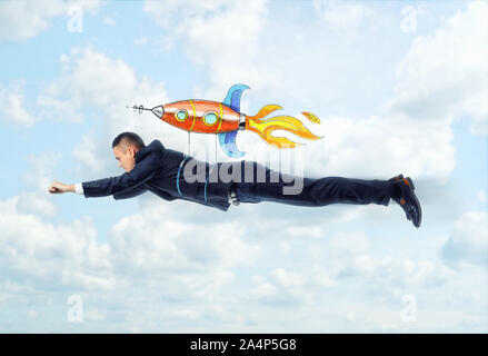 Businessman is flying on the rocket Stock Photo