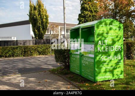 green clothes collection box, Germany, Meckenheim - 14 10 2019 Stock Photo