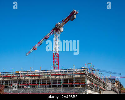 Construction crane on a construction site in the city Stock Photo