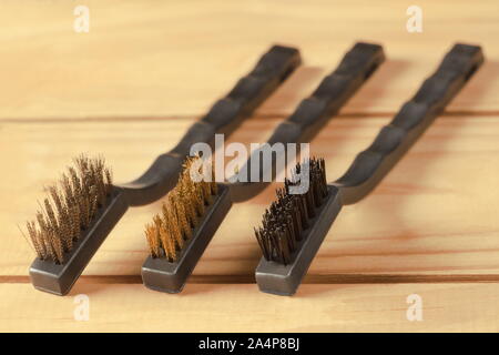 few small brushes made with wire, brass and  plastic Stock Photo
