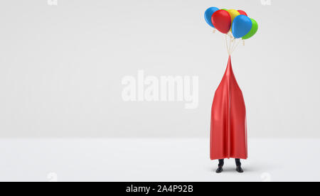 A businessman hidden under a red glossy cloth that has several colorful balloons tied to its center. Stock Photo