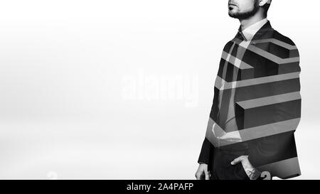 A businessman in black and white shot standing in half side view with white see-through lines of a maze over his body. Stock Photo