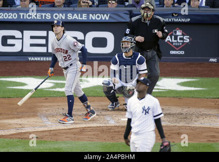 Bronx, United States. 15th Oct, 2019. Houston Astros Josh Reddick hits a solo home-run in the 2nd inning against the New York Yankees in game 3 of the American League Championship Series at Yankee Stadium on Tuesday, October 15, 2019 in New York City. The Yankees and the Astros are tied in the best of 7 series 1-1. Photo by John Angelillo/UPI Credit: UPI/Alamy Live News Stock Photo