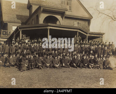 Ex-President Theodore Roosevelt (1st row, center). Sitting on Lawn of his Residence, Sagamore Hill, with a group of Men in Top Hats, Oyster Bay, New York, USA, March 31, 1909 Stock Photo