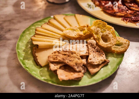 A cheese platter from deli bar Magnum in the Basque country city of Bilbao in Northern Spain Stock Photo