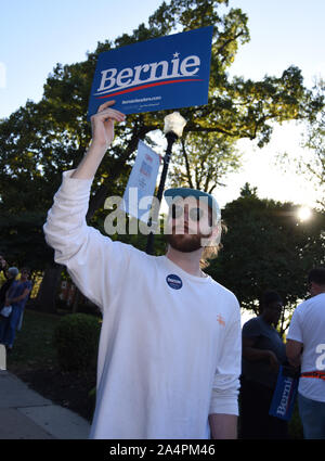 Westerville, Ohio, USA. 15th Oct, 2019. Jacob Schmeling, a student at the Ohio State University, holds a Bernie Sanders sign.Democratic presidential candidates take the stage prior to the CNN/New York Times Democratic Debate on the campus of Otterbein University in Westerville, Ohio on Tuesday, October 15, 2019. Candidate include former Vice President Joe Biden; New Jersey Sen. Cory Booker; Mayor Pete Buttigieg of South Bend, Indiana; former Housing Secretary Juli‡n Castro; California Sen. Kamala Harris; Minnesota Sen. Amy Klobuchar; former Texas Rep. Beto O'Rourke; Massachusetts Sen. Credit:  Stock Photo