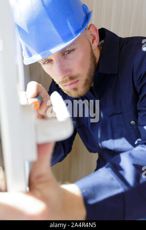 construction worker sets of metal and plastic window Stock Photo