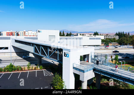 Pedestrian bridge leading to West Dublin/Pleasanton BART station of Bay Area Rapid Transit system. BART station located in the median of the highway I Stock Photo