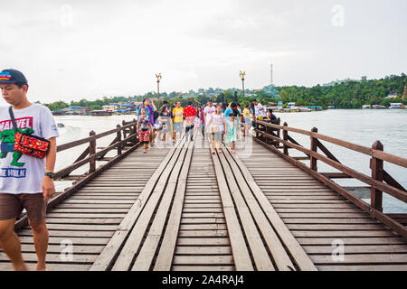 Thailand, Kanchanaburi - October 5, 2019: People and tourists sightseeing at Uttama Nusorn Wooden Bridge, Mon bridge in Thailand,across the Songgaria Stock Photo