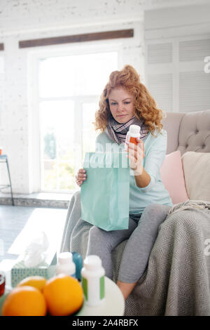 Woman taking vitamin C while suffering from seasonal epidemic