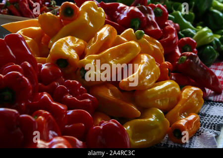 Biologic, natural cultivated sweet pepper on a market counter. Vegetables from the farmers market. Ecologic products. Natural background. Stock Photo
