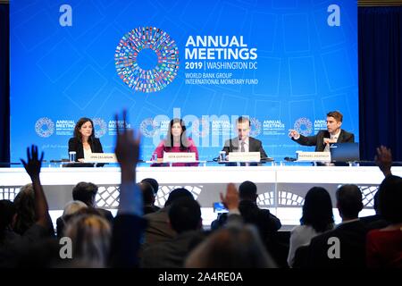 Beijing, USA. 15th Oct, 2019. International Monetary Fund (IMF) chief economist Gita Gopinath (2nd L) attends a press conference in Washington, DC, the United States, on Oct. 15, 2019. The International Monetary Fund (IMF) on Tuesday lowered its global growth forecast for 2019 to 3 percent in the newly-released World Economic Outlook (WEO) report, down 0.2 percentage point from its estimation in July. Credit: Liu Jie/Xinhua/Alamy Live News Stock Photo