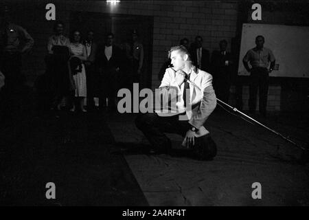 Elvis Presley during a performance at the University of Dayton Fieldhouse, May 27, 1956. Stock Photo