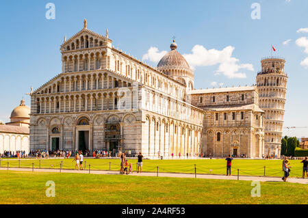Pisa, Italy - September 03, 2019: The Pisa Cathedral complex or Cattedrale di Pisa and the famous leaning Tower of Pisa or La Torre di Pisa Stock Photo