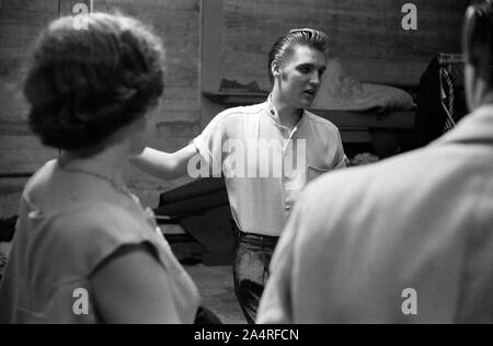 Elvis Presley backstage with fans at the University of Dayton Fieldhouse, May 27, 1956.