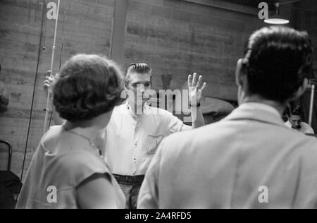 Elvis Presley backstage with fans at the University of Dayton Fieldhouse, May 27, 1956.